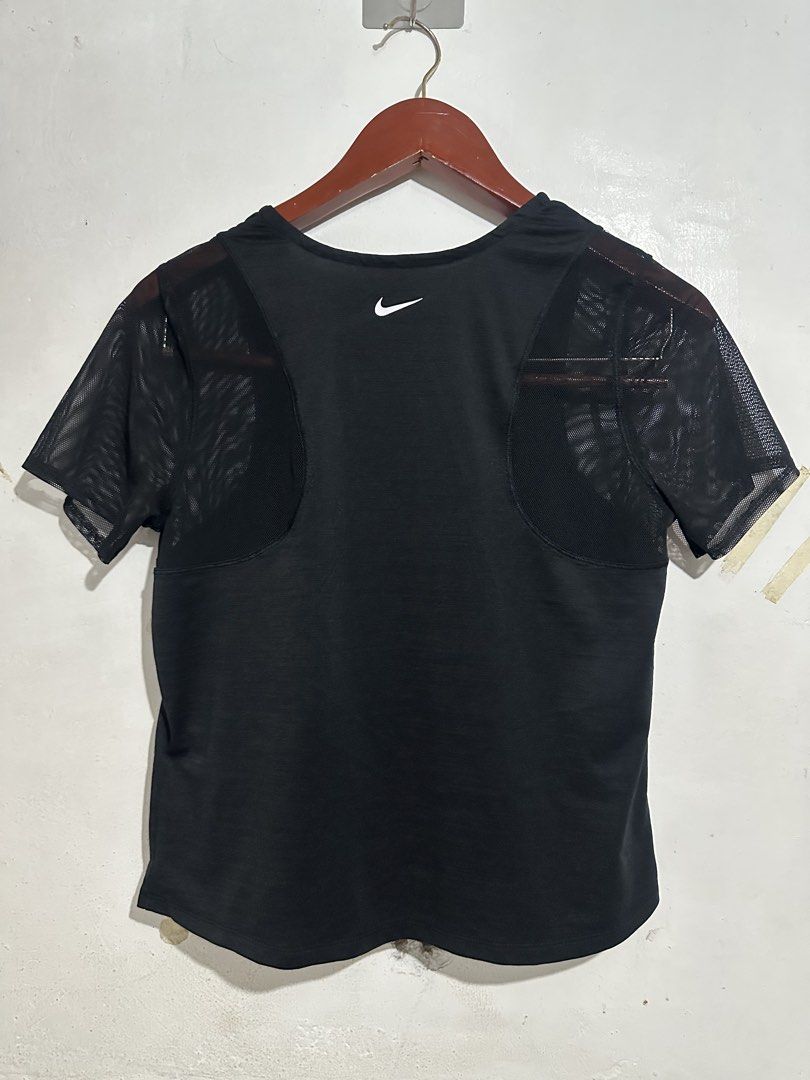 Nike Dri-FIT SS Runway short-sleeve (Category: Activewear) located in Quezon City. Submitted by jeconiah.tayuman (Listing ID 1462221782, Image 3). Description: Good as new no issues Xl on tag Stretchable Fit to S-L Depende sa Dimensions 17x22 Black Nike Dri-Fit running t-shirt - Size XL - Mesh sleeves for enhanced breathability - Classic Nike logo graphic on the front - Small Nike swoosh on the back - Made in Sri Lanka.