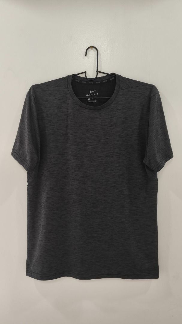 Nike Dry-fit (Category: Activewear) located in Quezon City. Submitted by secondtonone12 (Listing ID 1462053960, Image 1). Description: Nike Style: Short-sleeve crew-neck performance T-shirt, designed for running and athletic activities. Collection/Technology: Nike Dri-FIT, a moisture-wicking performance fabric designed to help keep the wearer dry and comfortable. Fabric Appearance: Fine, horizontal heathered texture throughout the shirt, giving i
