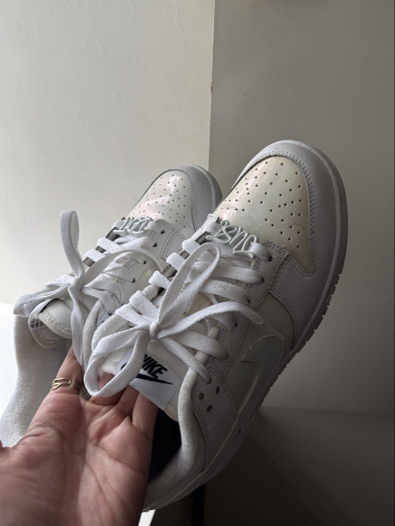 Nike Dunk Low (Category: Sneakers) located in Pasay City. Submitted by shop.stylestaple (Listing ID 1462048857, Image 1). Description: - Nike Dunk White Iridescent Sneakers - Subtle iridescent sheen on toe box and heel - Classic low-top silhouette - White laces - Great for everyday wear - no more box! - size 7.5wmns.