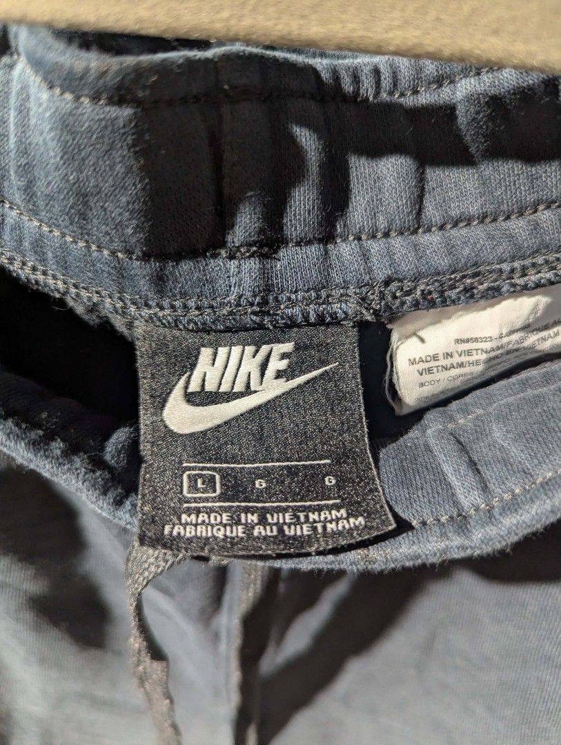 Nike Men's Athletic Shorts Size L (Category: Shorts) located in Manila. Submitted by roblesniks33584 (Listing ID 1462053101, Image 2). Description: - Nike Athletic Shorts - Color: Dark Blue with White Swoosh Logo - Size: Large (L) - Features: Elastic waistband with drawstring for adjustable comfort - Material: Soft and breathable fabric - Ideal for: Workouts, running, gym sessions, or casual wear.