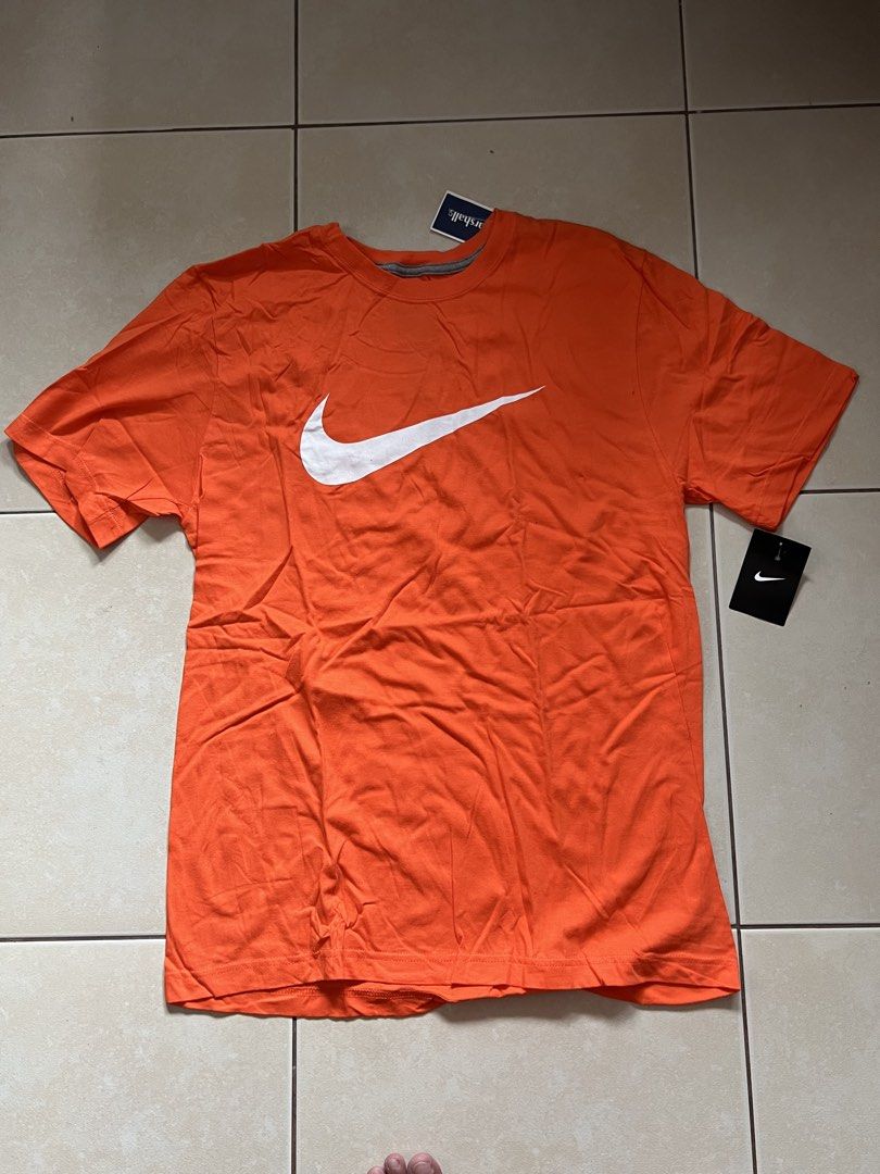 Nike Orange T-Shirt Regular Fit (Category: Tshirts & Polo Shirts ) located in Mandaluyong City. Submitted by luna_elisse (Listing ID 1462074864, Image 1). Description: - Orange Nike T-shirt - Size: Large - Fit: Regular - Neckline: Crew neck - Material: 100% Cotton - Made in: Honduras - Ideal for: Everyday wear - Comfortable and stylish! -Price:600+sf -MOP: Gcash/BDO/GoTyme -Location: Mandaluyong -RFS: decluttering.