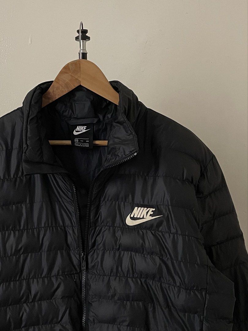 Nike Puffer Jacket (Category: Coats, Jackets and Outerwear) located in Marikina City. Submitted by stillnessliteral (Listing ID 1462035405, Image 3). Description: Nike Puffer Jacket size: XXL Dimension W 24.5 | L 28.5 | SL 26.5 color rate: 10/10 issue: two pinhole and very small unnoticeable ended stitch 🏷️ 1500 excellent overall condition dm for more info 📩.