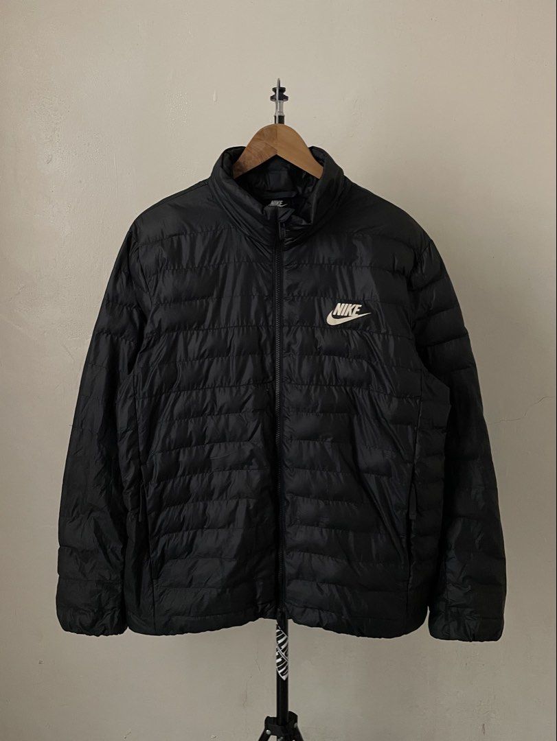 Nike Puffer Jacket (Category: Coats, Jackets and Outerwear) located in Marikina City. Submitted by stillnessliteral (Listing ID 1462035405, Image 1). Description: Nike Puffer Jacket size: XXL Dimension W 24.5 | L 28.5 | SL 26.5 color rate: 10/10 issue: two pinhole and very small unnoticeable ended stitch 🏷️ 1500 excellent overall condition dm for more info 📩.