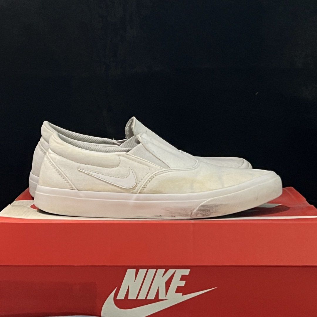 NIKE SB Slip-on (Category: Sneakers) located in Bulacan. Submitted by mpbarro (Listing ID 1462121523, Image 2). Description: - White Nike slip-on sneakers - Canvas material - Light marks on sides and soles from normal wear - Still in good, wearable condition - Great for casual outings NOTES - Not the original box.