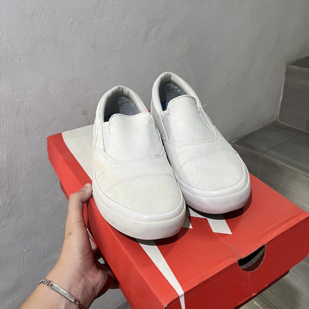 NIKE SB Slip-on (Category: Sneakers) located in Bulacan. Submitted by mpbarro (Listing ID 1462121523, Image 1). Description: - White Nike slip-on sneakers - Canvas material - Light marks on sides and soles from normal wear - Still in good, wearable condition - Great for casual outings NOTES - Not the original box.