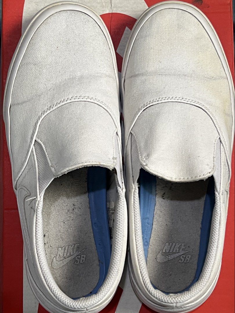 NIKE SB Slip-on (Category: Sneakers) located in Bulacan. Submitted by mpbarro (Listing ID 1462121523, Image 3). Description: - White Nike slip-on sneakers - Canvas material - Light marks on sides and soles from normal wear - Still in good, wearable condition - Great for casual outings NOTES - Not the original box.