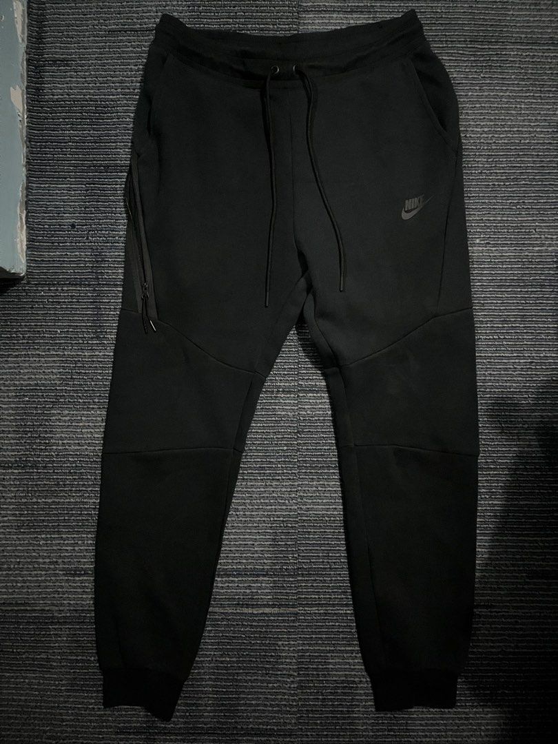 Nike Tech Fleece Joggers Black Size M (Category: Joggers) located in Pasay City. Submitted by Oboyyy (Listing ID 1462214771, Image 1). Description: - Black Nike Tech Fleece Joggers - Size: Medium - Classic Nike logo on left thigh - Side zippered pocket for secure storage - Adjustable drawstring waist for a custom fit - Comfortable and stylish for everyday wear.