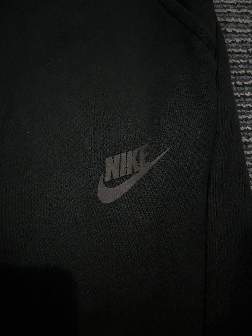 Nike Tech Fleece Joggers Black Size M (Category: Joggers) located in Pasay City. Submitted by Oboyyy (Listing ID 1462214771, Image 3). Description: - Black Nike Tech Fleece Joggers - Size: Medium - Classic Nike logo on left thigh - Side zippered pocket for secure storage - Adjustable drawstring waist for a custom fit - Comfortable and stylish for everyday wear.