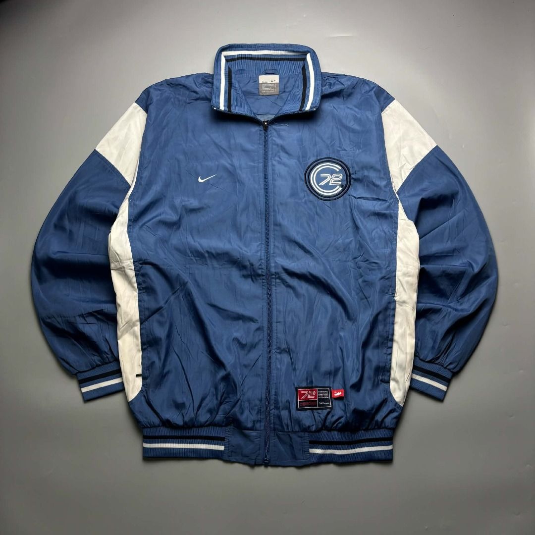 Nike Vintage '72 Track Jacket (Category: Coats, Jackets and Outerwear) located in Andop. Submitted by new.hanger (Listing ID 1462077612, Image 1). Description: 🔥 VINTAGE NIKE 72 TRACK JACKET 🔥 Clean vintage Nike 72 full-zip track jacket in blue & white. 💙🤍 Perfect for 90s / Y2K / old-school streetwear fits. • Brand: Nike • Size: XXXL • Measurements: 24 × 30 • Condition: Good vintage condition • Style: Full-Zip Track Jacket / Windbreaker • Det