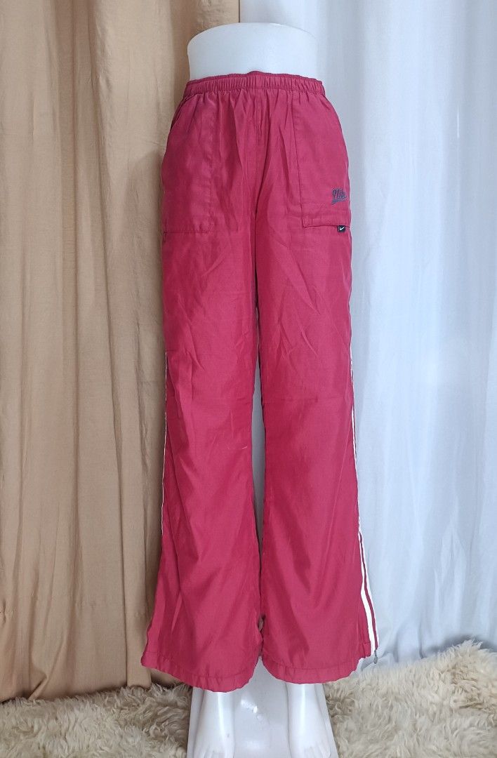 Nike Vintage Track Pants (Category: Other Bottoms) located in La Trinidad. Submitted by starlascloset (Listing ID 1462260567, Image 1). Description: Waist can fit 28-39 Length 39 With size zipper at the bottom Flaw is seen in the photo..