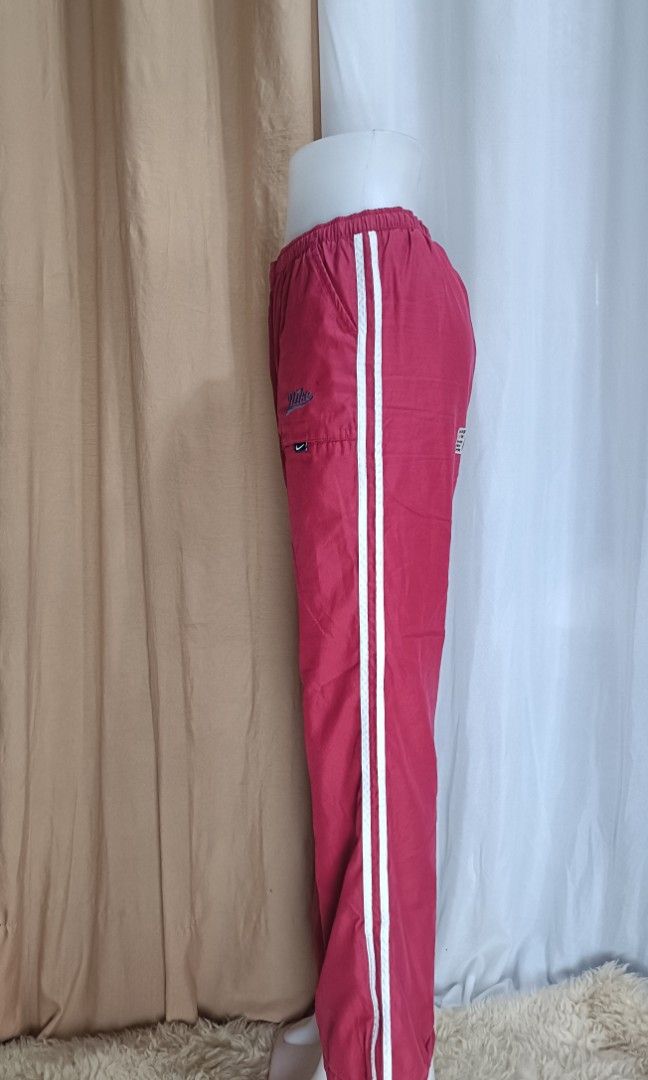 Nike Vintage Track Pants (Category: Other Bottoms) located in La Trinidad. Submitted by starlascloset (Listing ID 1462260567, Image 2). Description: Waist can fit 28-39 Length 39 With size zipper at the bottom Flaw is seen in the photo..