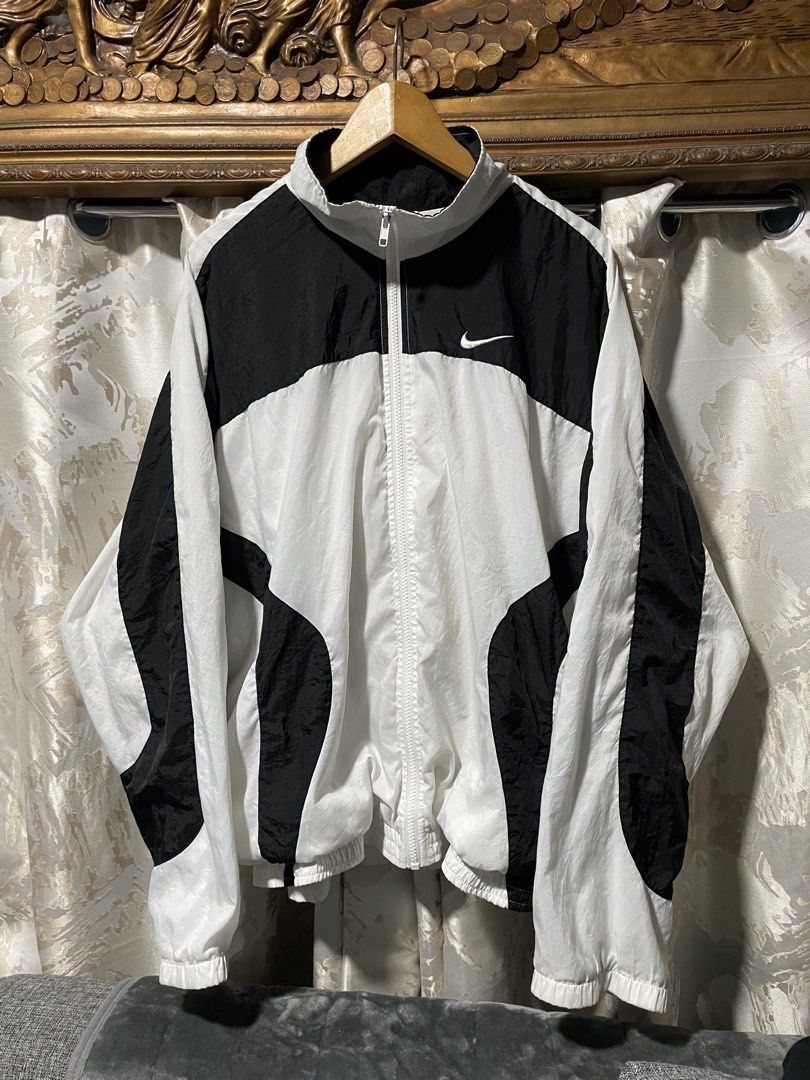 Nike Windbreaker Jacket Black White (Category: Coats, Jackets and Outerwear) located in Caloocan City. Submitted by thrift.enough (Listing ID 1462156493, Image 1). Description: - Classic Nike windbreaker jacket - Black and white colorway - Full zip closure - Elastic cuffs and hem - Ideal for everyday wear or sports - Made in Taiwan - Size L -28x28.