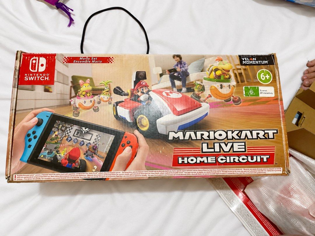 Nintendo Switch Mario Kart Live Home Circuit (Category: Nintendo) located in Caloocan City. Submitted by apolsevill80737 (Listing ID 1462107422, Image 1). Description: ‼️ Selling > MARIO KART HOME CIRCUIT for Nintendo Switch‼️🏎️ Signs of usage sa wheels, which is normal. Can be cleaned naman. - Experience Mario Kart in real life with Nintendo Switch! - Includes Mario Kart Live: Home Circuit game and RC Mario Kart. - Design your own race tracks u