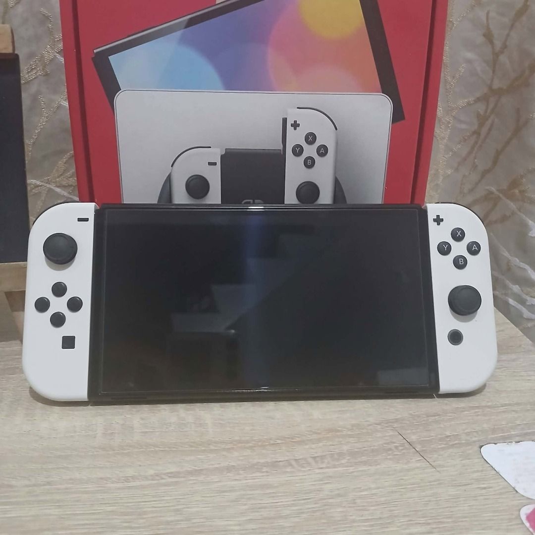 Nintendo Switch OLED Model White Super Fresh! (Category: Nintendo) located in Paranaque City. Submitted by thebiskwitcompany (Listing ID 1462180886, Image 2). Description: #187 Nintendo Switch Oled P10995 -Complete (Unit, Charger, Joycons, Dock, HMDI, etc.. -No Issue (buttons, analog, eshop, micro sd card reader, wifi etc) -with tempered glass since day 1 -like new and super fresh pa! Shipping through Lalamove, Grab, JNT, LBC (COD/COP) Pickup @ 4