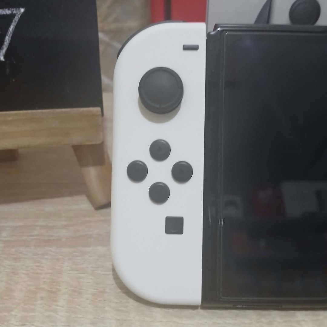 Nintendo Switch OLED Model White Super Fresh! (Category: Nintendo) located in Paranaque City. Submitted by thebiskwitcompany (Listing ID 1462180886, Image 3). Description: #187 Nintendo Switch Oled P10995 -Complete (Unit, Charger, Joycons, Dock, HMDI, etc.. -No Issue (buttons, analog, eshop, micro sd card reader, wifi etc) -with tempered glass since day 1 -like new and super fresh pa! Shipping through Lalamove, Grab, JNT, LBC (COD/COP) Pickup @ 4