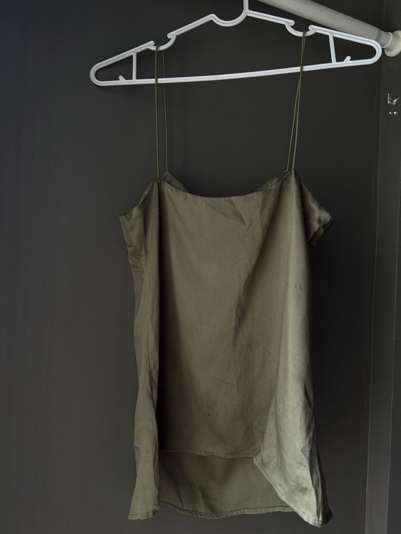 Olive Green Spaghetti Strap Cami Top (Category: Sleeveless) located in Manila. Submitted by francinemanaois (Listing ID 1462072248, Image 2). Description: - Olive green cami top - Thin spaghetti straps - Square neckline - Silky material - Best fits size Small to Medium - Versatile: great for layering or wearing on its own - Simple and chic design.