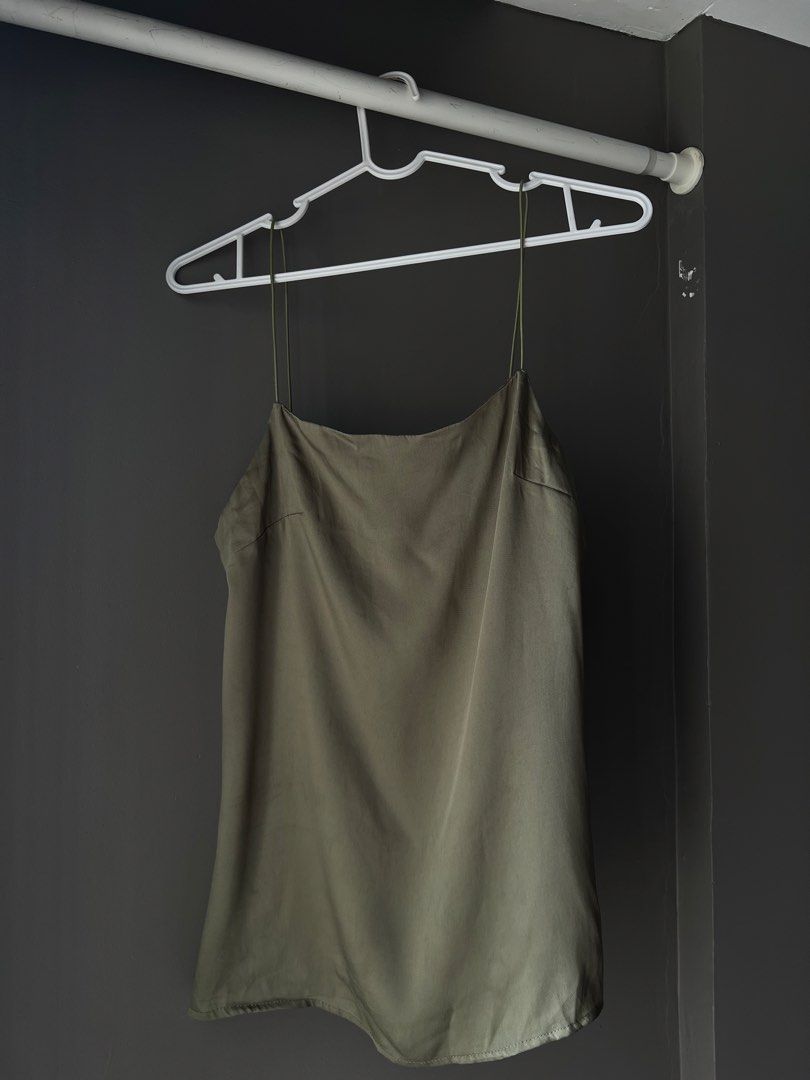 Olive Green Spaghetti Strap Cami Top (Category: Sleeveless) located in Manila. Submitted by francinemanaois (Listing ID 1462072248, Image 1). Description: - Olive green cami top - Thin spaghetti straps - Square neckline - Silky material - Best fits size Small to Medium - Versatile: great for layering or wearing on its own - Simple and chic design.