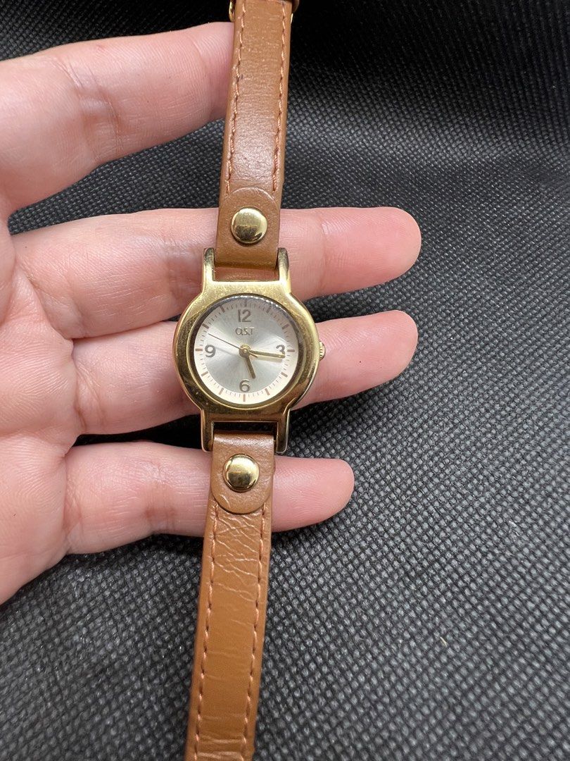 OST Quartz ladies watch (Category: Women's Watches) located in Pasig City. Submitted by lailahbeauty (Listing ID 1462172638, Image 2). Description: For sale onhand OST Quartz ladies Watch. This watch is Made from China. Preloved watch from Japan. Working product. For more details you can contact me directly for fast transaction. Buy now! I can shipping nationwide! - Gold tone watch with a light silver dial - Simple brown leather strap with gold t