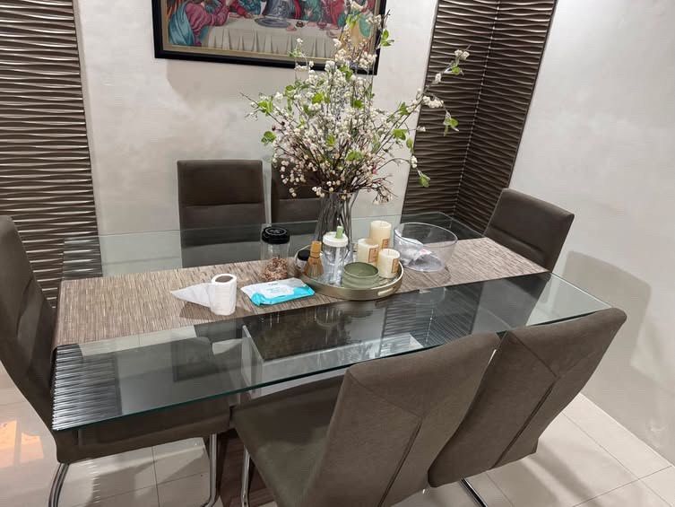 Our Home 6-seater Dining Set (Category: Tables & Sets) located in Quezon City. Submitted by laraveee (Listing ID 1462203368, Image 2). Description: Our Home 6-seater Dining Set This 6-Seater Dining Set is a modern contemporary dining furniture piece featuring a clear tempered glass table top and a chrome metal leg base. Had for a year and a half only, from Our Home RFS: Downsizing, moving to a smaller place *PICK-UP AT HOLY SPIRIT QC ONLY, ONLY I