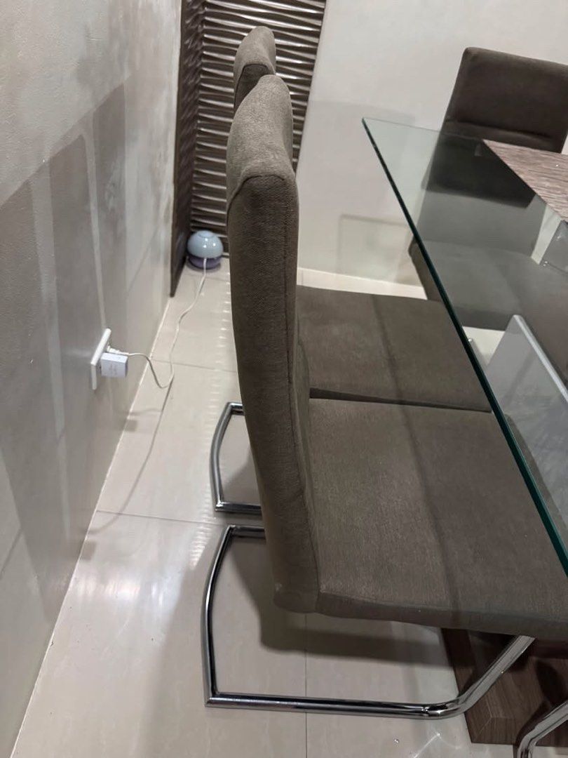 Our Home 6-seater Dining Set (Category: Tables & Sets) located in Quezon City. Submitted by laraveee (Listing ID 1462203368, Image 3). Description: Our Home 6-seater Dining Set This 6-Seater Dining Set is a modern contemporary dining furniture piece featuring a clear tempered glass table top and a chrome metal leg base. Had for a year and a half only, from Our Home RFS: Downsizing, moving to a smaller place *PICK-UP AT HOLY SPIRIT QC ONLY, ONLY I