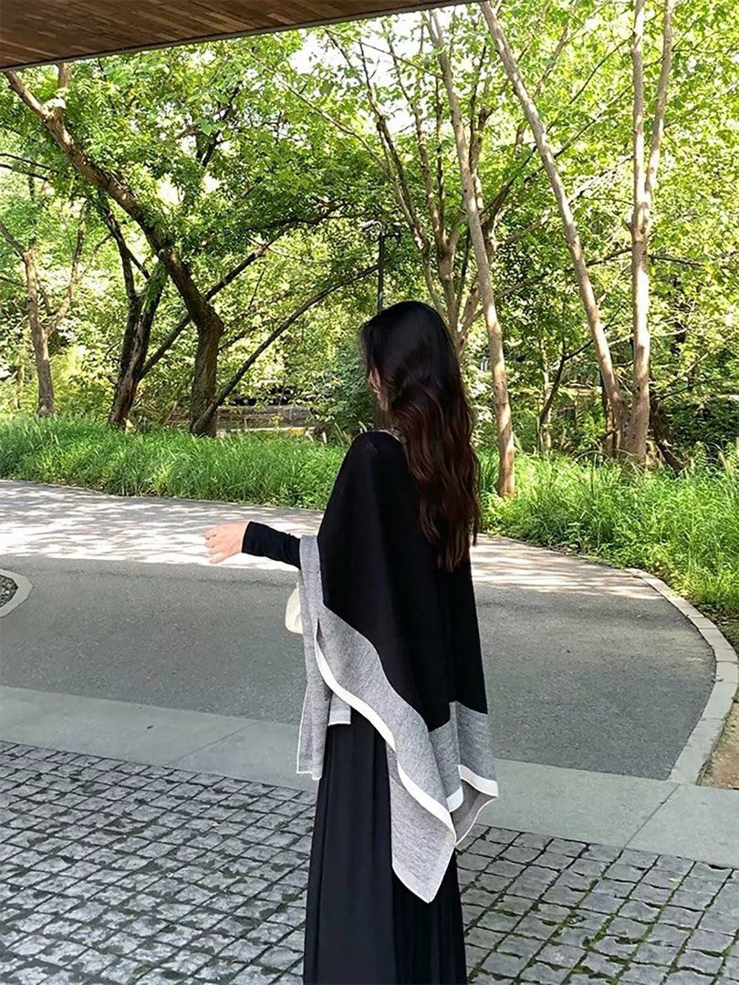Outer layer (Category: Coats, Jackets and Outerwear) located in Kuala Lumpur. Submitted by kirsten09 (Listing ID 1462162911, Image 2). Description: - Chic colorblock poncho in black, grey, and white. - Soft, comfortable material that drapes beautifully. - Ideal for layering over any outfit. - Perfect for staying warm and stylish in cooler weather. - One size fits most for easy wear..