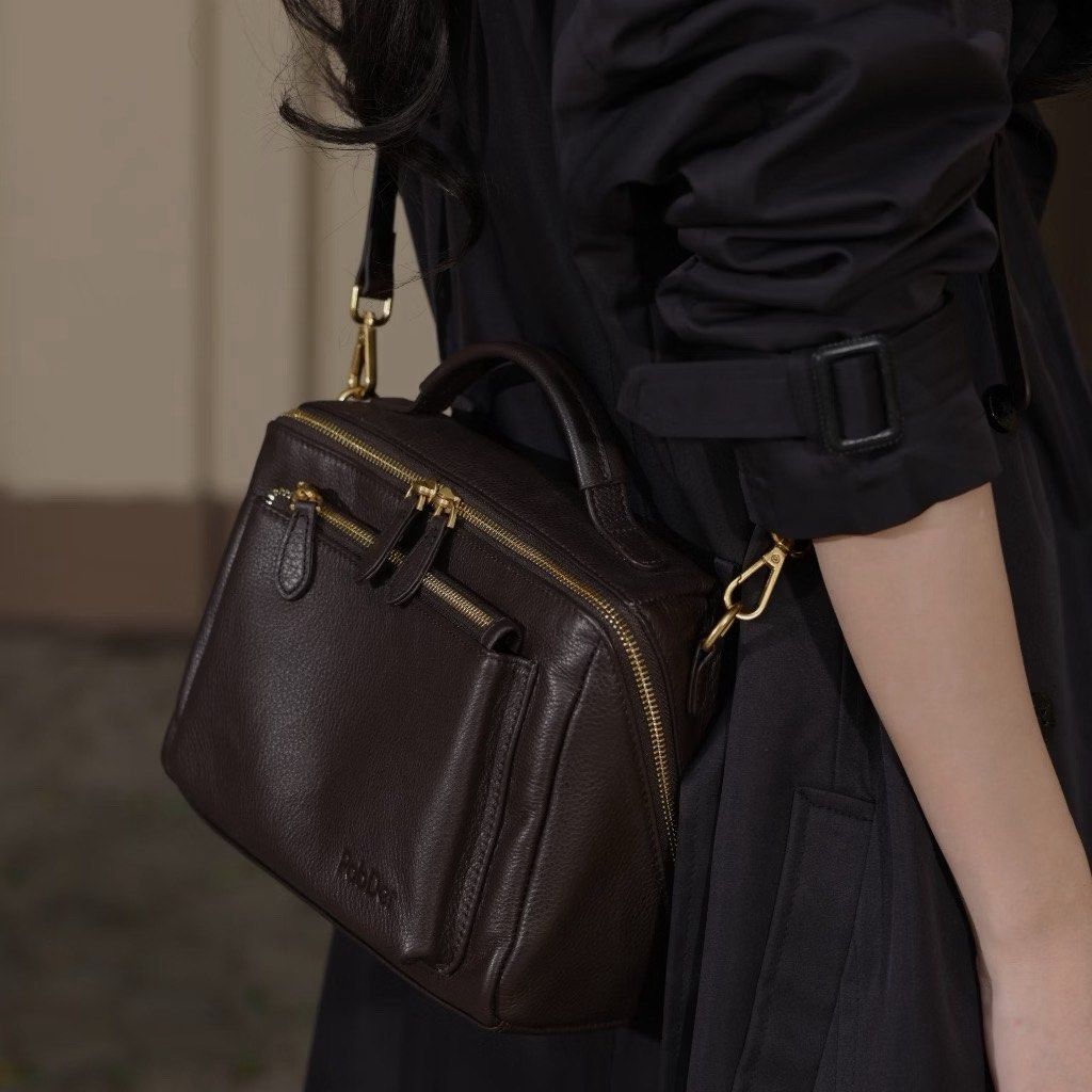 Pabder Soft Shoulder Sling Bag Dark Brown (Category: Shoulder Bags) located in Quezon City. Submitted by kmaeb (Listing ID 1462186439, Image 2). Description: - Dark brown leather sling bag - Top handle and detachable shoulder strap - Two zippered compartments on the front - Main compartment with zipper closure - Elegant gold hardware details - Ideal size for carrying everyday essentials With dustbag and hang tag .