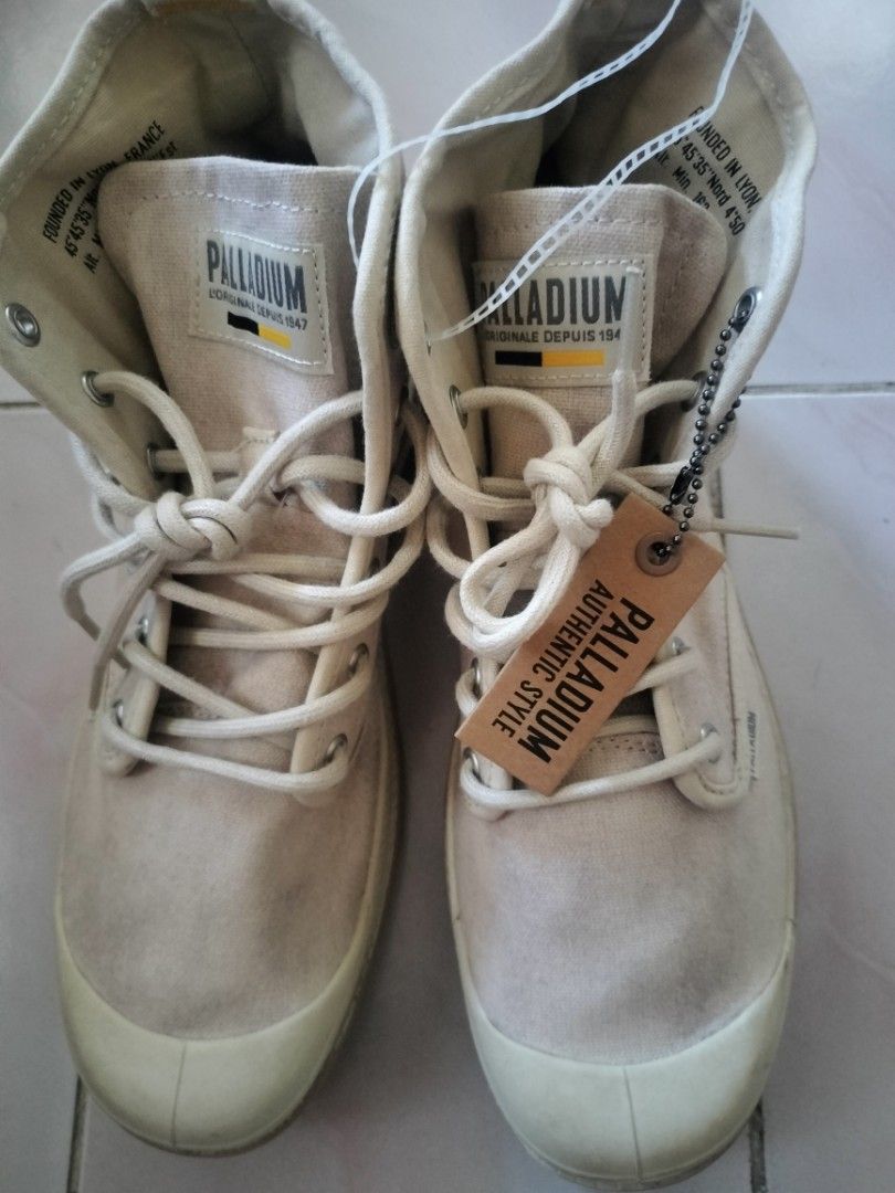 Palladium Beige Canvas High Top Boots (Category: Boots) located in Manila. Submitted by susanavila26232 (Listing ID 1462157198, Image 1). Description: - Palladium high-top boots in neutral beige canvas. - Classic lace-up closure for a secure fit. - Features the iconic Palladium logo on the side. - Built with a durable rubber sole for long-lasting wear. - Ideal for everyday casual style. - Comes with original tags attached..