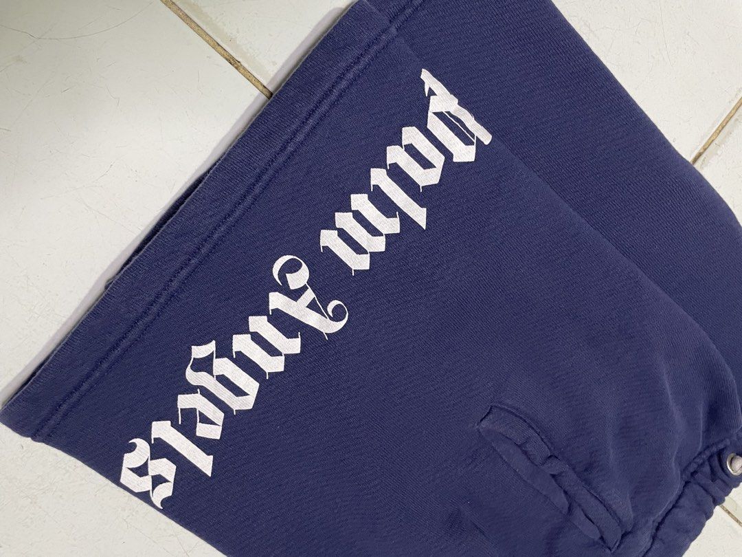 Palm Angels Navy Blue Logo Shorts Size 8 (Category: Shorts) located in Cebu City. Submitted by pinoclifford (Listing ID 1462042012, Image 2). Description: - Navy blue Palm Angels shorts - Iconic white logo on the side - Drawstring waist for a comfortable fit - Made from 100% cotton - Size 8 - Ideal for casual wear.