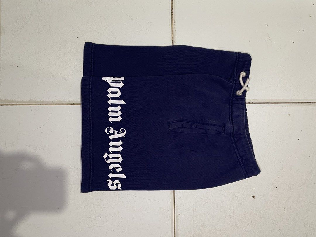 Palm Angels Navy Blue Logo Shorts Size 8 (Category: Shorts) located in Cebu City. Submitted by pinoclifford (Listing ID 1462042012, Image 1). Description: - Navy blue Palm Angels shorts - Iconic white logo on the side - Drawstring waist for a comfortable fit - Made from 100% cotton - Size 8 - Ideal for casual wear.