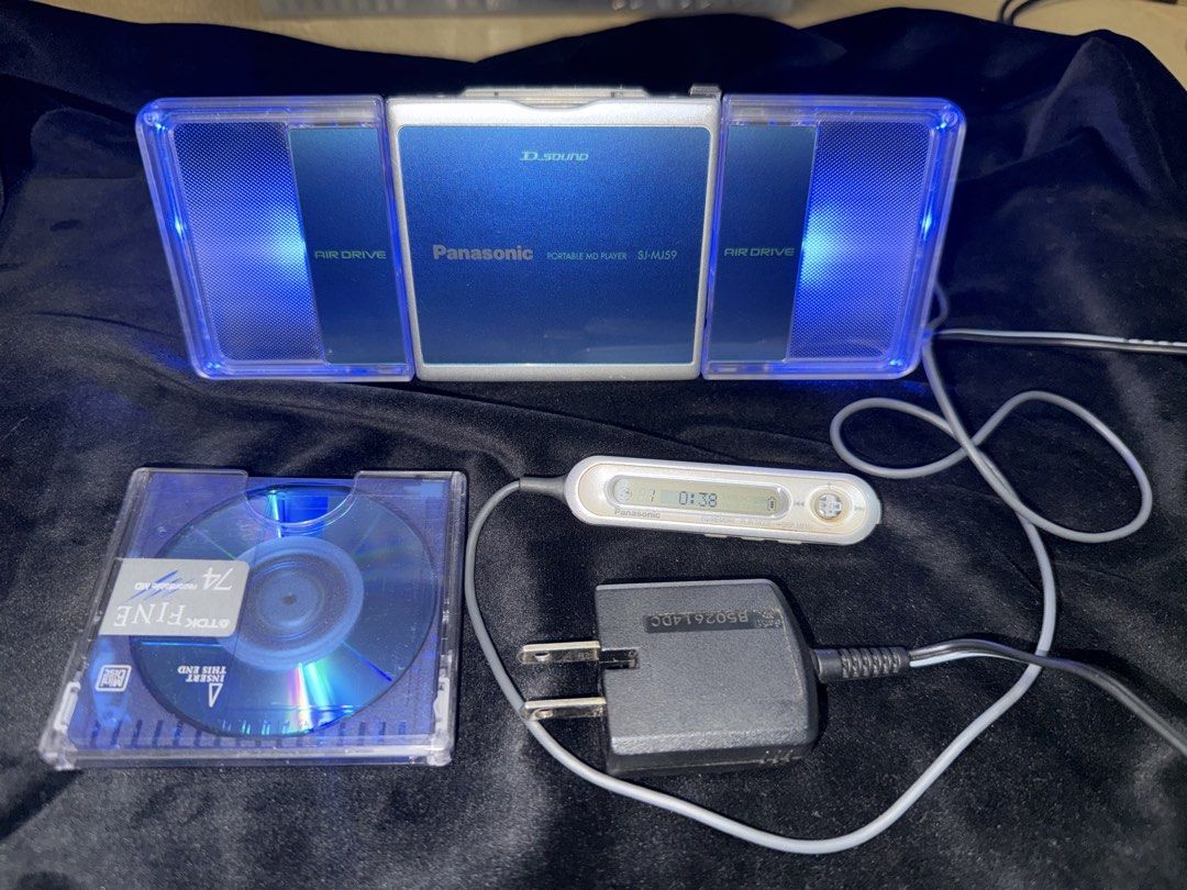 Panasonic Minidisc Player SJ-MJ59 with Speaker (Category: Portable Music Players) located in Makati City. Submitted by see5o5 (Listing ID 1462049854, Image 2). Description: - Panasonic MD portable MiniDisc player SJ-MJ59 - Tested and working (needs a new battery) - Includes: Air Drive speaker/charging dock, AC Adapter (100v), remote control - Also comes with one MiniDisc and the original Panasonic battery that needs to be replaced. This is over 2