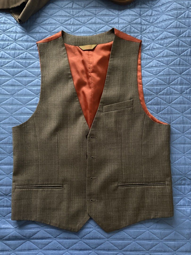 Paul Stuart Grey Plaid Wool Vest (Category: Vests) located in Manila. Submitted by paulseller009 (Listing ID 1462042791, Image 1). Description: - Grey plaid vest by Paul Stuart - Burnt orange satin lining - Two front pockets - Button closure - Ideal for layering over shirts - Sharp and stylish look.