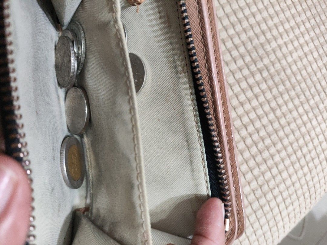 Pink Bifold Wallet with Zipper Coin Compartment (Category: Wallets & Card holders) located in Davao. Submitted by jenpolinar (Listing ID 1462190127, Image 3). Description: - Pink bifold wallet - Zipper compartment for coins - Plenty of card slots - Space for bills - Gold hardware details - Minor signs of wear on zipper pull and edges - Still functional and looks good.