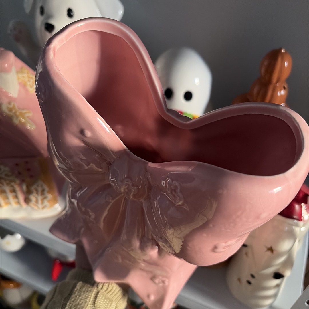 Pink Bow Ceramic Vase (Category: Vases & Decorative Bowls) located in Manila. Submitted by itsandrea (Listing ID 1462204798, Image 2). Description: - Adorable pink ceramic vase shaped like a big bow. - Features delicate little flower details all over. - Ideal for displaying small bouquets or as a charming desk accessory. - Adds a sweet and cute touch to any room's decor. - A must-have for collectors of unique and kawaii ceramics..
