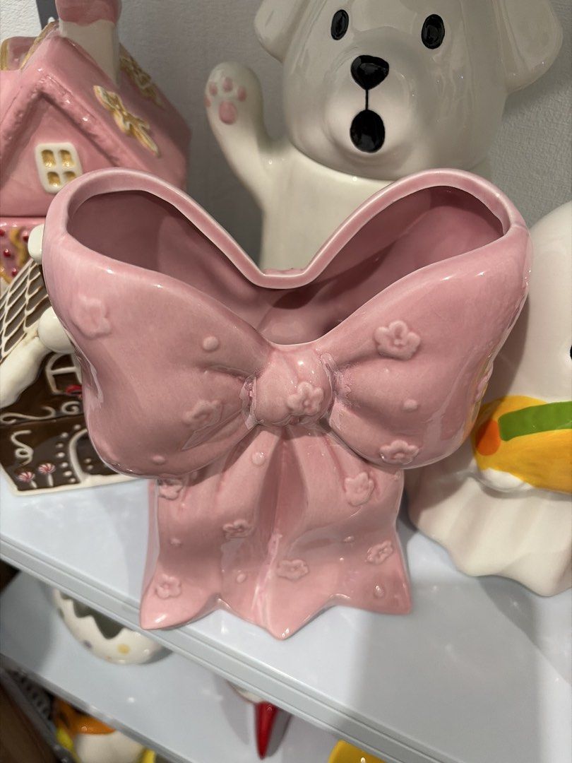 Pink Bow Ceramic Vase (Category: Vases & Decorative Bowls) located in Manila. Submitted by itsandrea (Listing ID 1462204798, Image 3). Description: - Adorable pink ceramic vase shaped like a big bow. - Features delicate little flower details all over. - Ideal for displaying small bouquets or as a charming desk accessory. - Adds a sweet and cute touch to any room's decor. - A must-have for collectors of unique and kawaii ceramics..