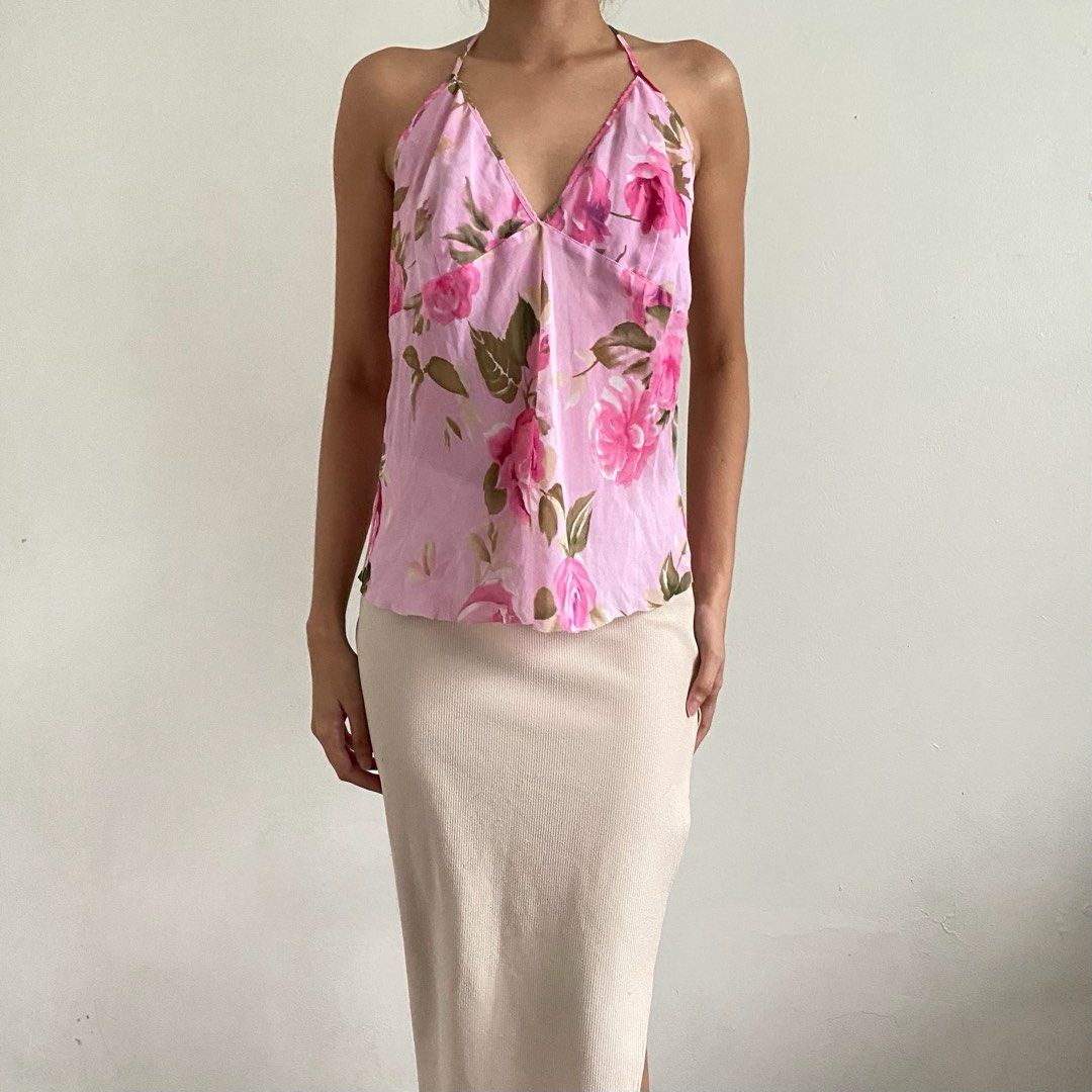 Pink Floral Halter Neck Top (Category: Sleeveless) located in Tarlac. Submitted by luv__vintage (Listing ID 1462259467, Image 1). Description: - Cute pink halter top - Vibrant floral print - V-neckline - Tie-back closure - Lightweight and flowy material - Perfect for casual or night out.