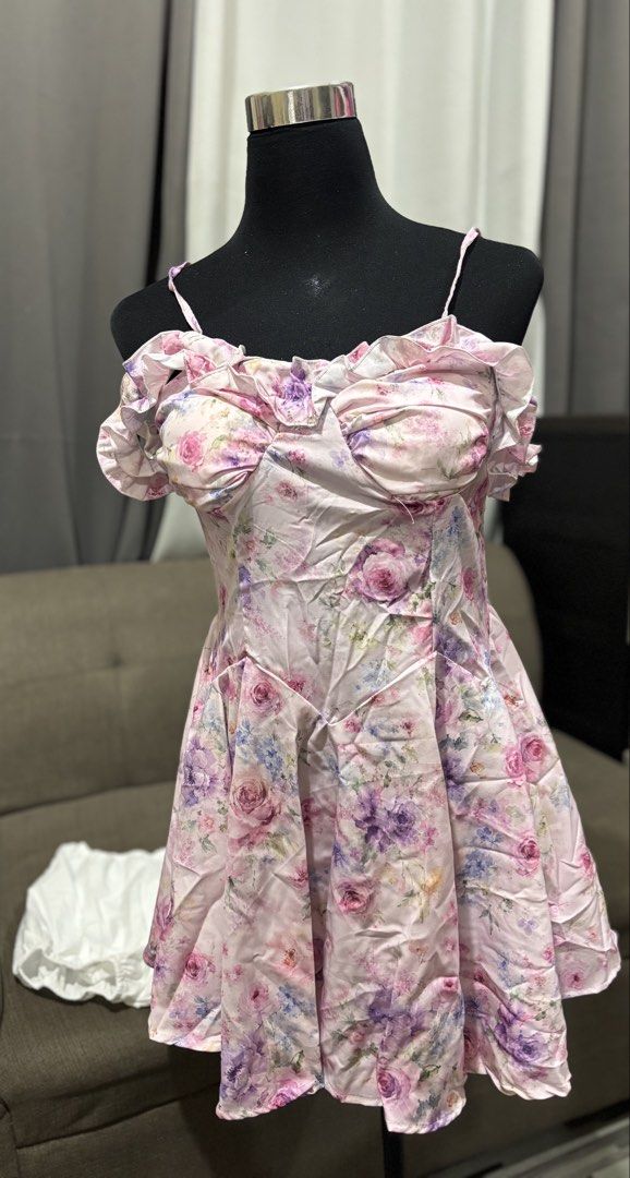 Pink Floral Ruffle Off-Shoulder Mini Dress (Category: Dresses) located in Caloocan City. Submitted by niki.niki. (Listing ID 1462257521, Image 1). Description: - Adorable pink floral mini dress - Features charming ruffle details on neckline and sleeves - Stylish off-shoulder design with thin straps - Flattering A-line skirt for a beautiful silhouette - Ideal for parties, dates, or a night out - Fits medium to large sizes.
