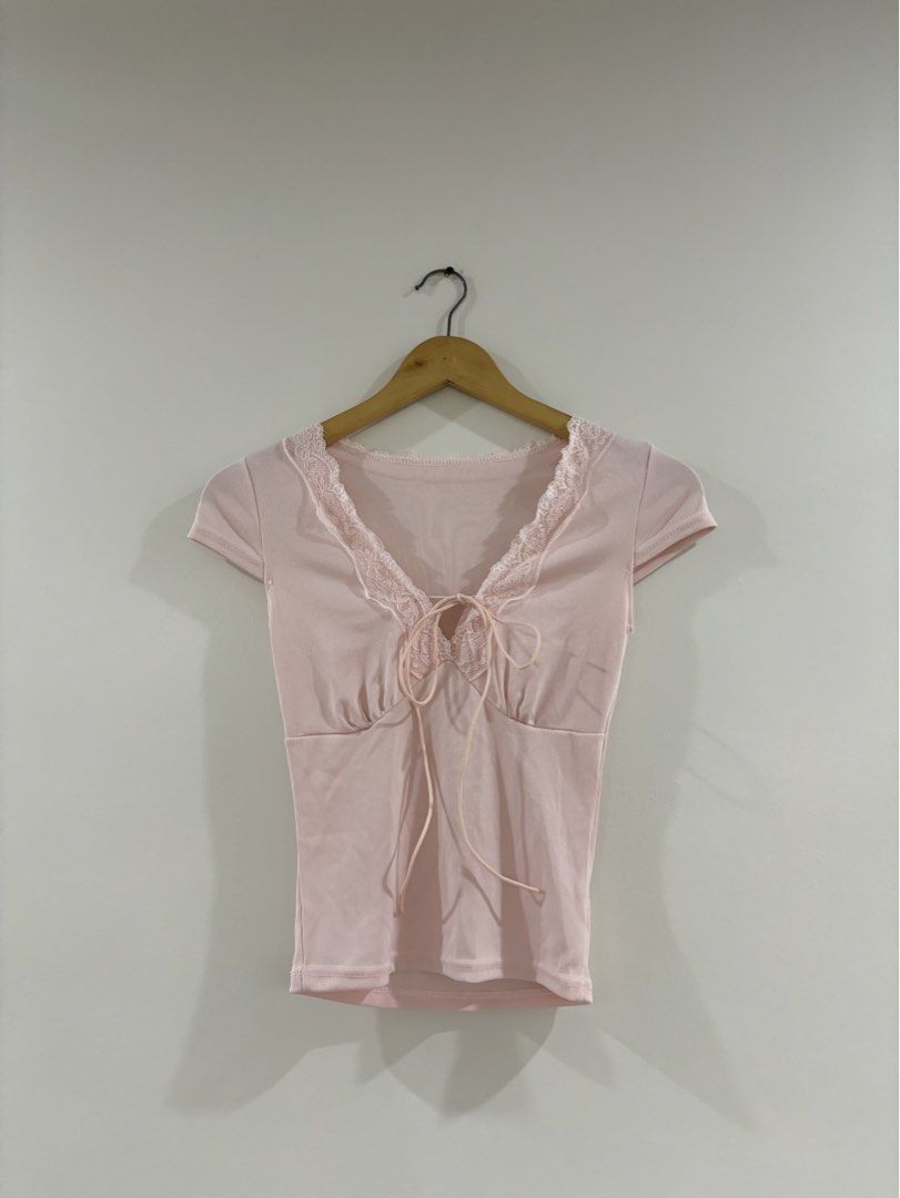 Pink Lace Trim Tie Front Ribbed Top (Category: Sleeveless) located in Bulacan. Submitted by janeeeeelleeeee (Listing ID 1462217455, Image 1). Description: - Cute pink ribbed top - Lace trim along neckline - Tie front detail - Short sleeves - Versatile: pairs well with jeans or skirts - Ideal for casual outings or nights with friends - Easy to style and comfortable - XS-S.