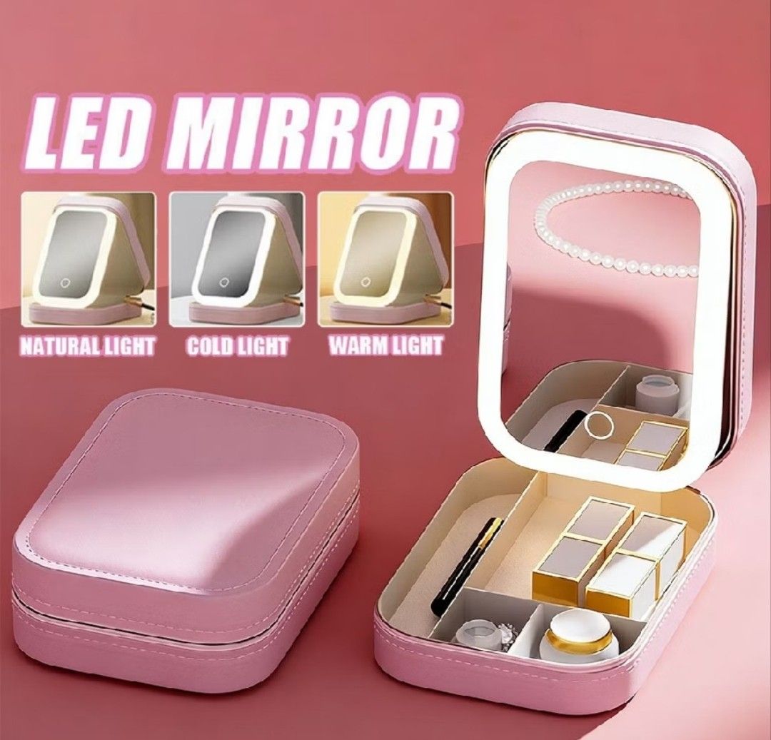 Pink LED Mirror Jewelry Box with Storage (Category: Accessory Holder, Box & Organizers) located in Manila. Submitted by ljaneee (Listing ID 1462077021, Image 1). Description: - Portable jewelry and makeup organizer with secure zip closure. - Built-in LED mirror with 3 adjustable light settings: natural, cold, and warm. - Soft pink faux leather exterior. - Interior compartments for organized storage of jewelry and cosmetics. - Perfect for travel o