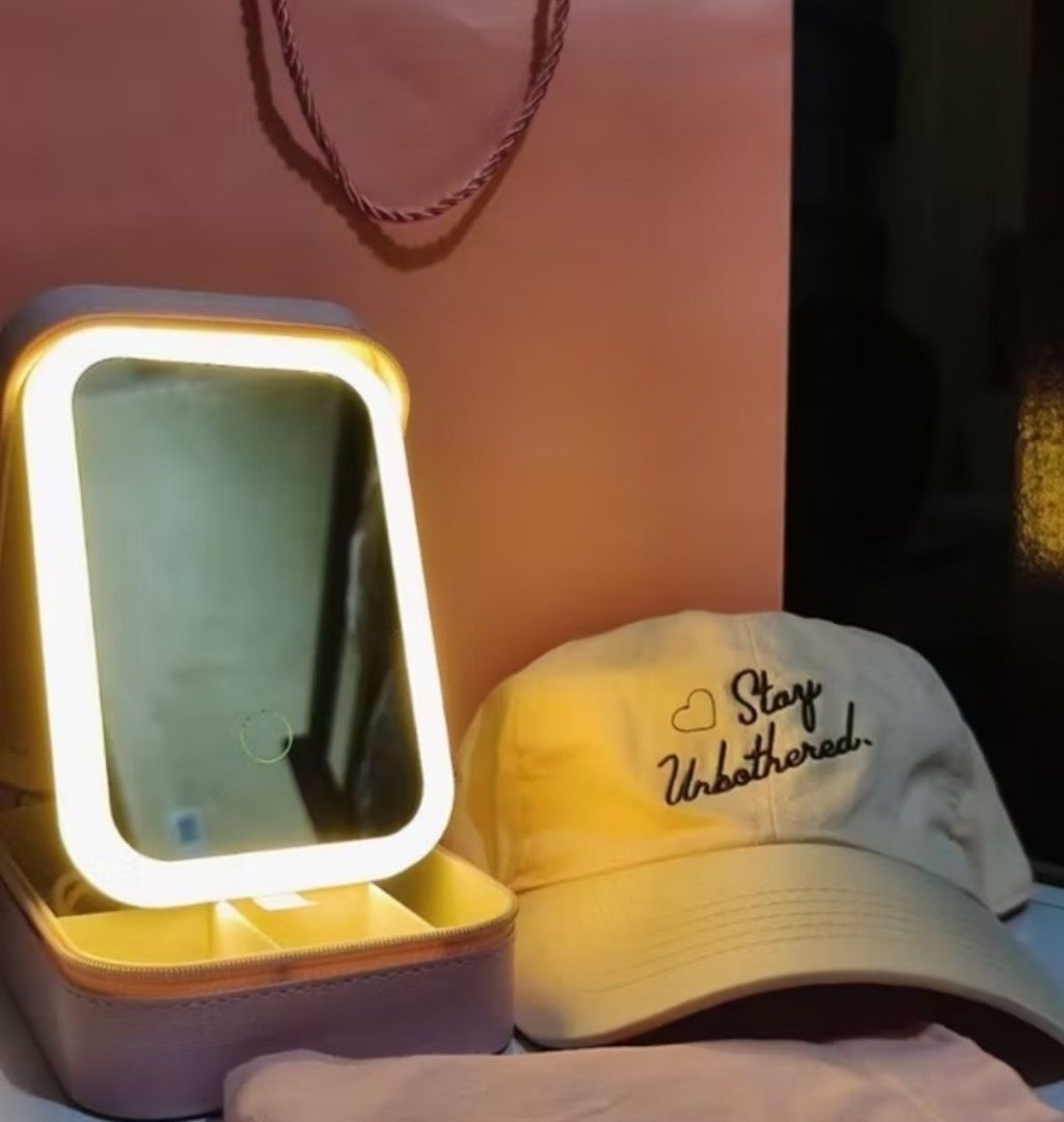 Pink LED Mirror Jewelry Box with Storage (Category: Accessory Holder, Box & Organizers) located in Manila. Submitted by ljaneee (Listing ID 1462077021, Image 3). Description: - Portable jewelry and makeup organizer with secure zip closure. - Built-in LED mirror with 3 adjustable light settings: natural, cold, and warm. - Soft pink faux leather exterior. - Interior compartments for organized storage of jewelry and cosmetics. - Perfect for travel o
