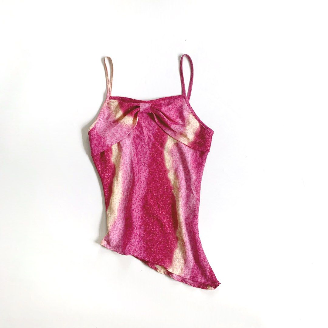 Pink Ribbon Front Camisole Top (Category: Sleeveless) located in Tarlac. Submitted by luv__vintage (Listing ID 1462259525, Image 2). Description: - Adorable pink camisole top - Unique marbled pattern in pink and yellow - Flattering tie-front detail - Delicate spaghetti straps - Stylish asymmetrical hemline - Versatile: pairs well with skirts or jeans.