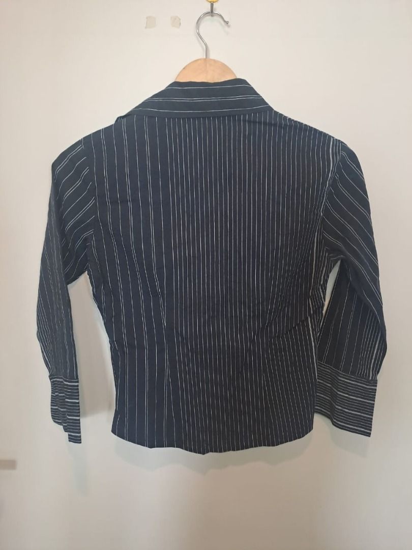 pinstripe longsleeve (Category: Longsleeves) located in Mandaluyong City. Submitted by epicowl-c93c (Listing ID 1462223698, Image 2). Description: This black pinstripe blouse features a beautifully structured, cinched waist design that balances sharp office tailoring with a flattering, feminine silhouette. Its unique paneling naturally defines the midsection, making it highly versatile for both corporate and smart-casual settings..