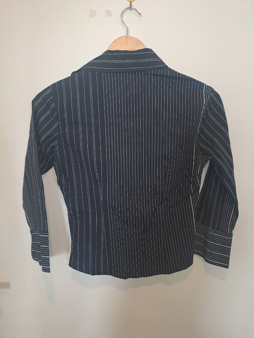 Pinstripe longsleve (Category: Longsleeves) located in Manila. Submitted by joanbalde39643 (Listing ID 1462128582, Image 2). Description: This black pinstripe blouse features a beautifully structured, cinched waist design that balances sharp office tailoring with a flattering, feminine silhouette. Its unique paneling naturally defines the midsection, making it highly versatile for both corporate and smart-casual settings..