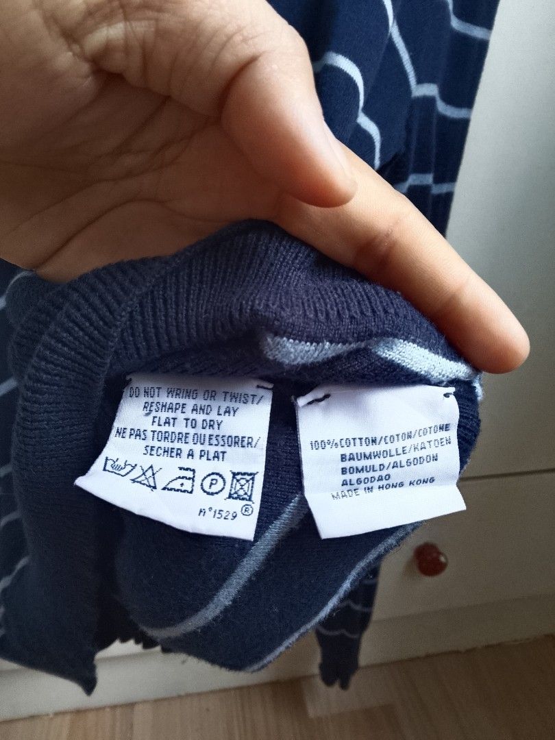 Polo by Ralph Lauren Striped Sweater (Category: Coats, Jackets and Outerwear) located in Bogo. Submitted by algarme2018 (Listing ID 1462070574, Image 3). Description: - Classic navy and white striped sweater - Brand: Polo by Ralph Lauren - Material: 100% Cotton - Style: Long sleeves, crew neck - Perfect for layering or wearing solo - Easy to style for any occasion.