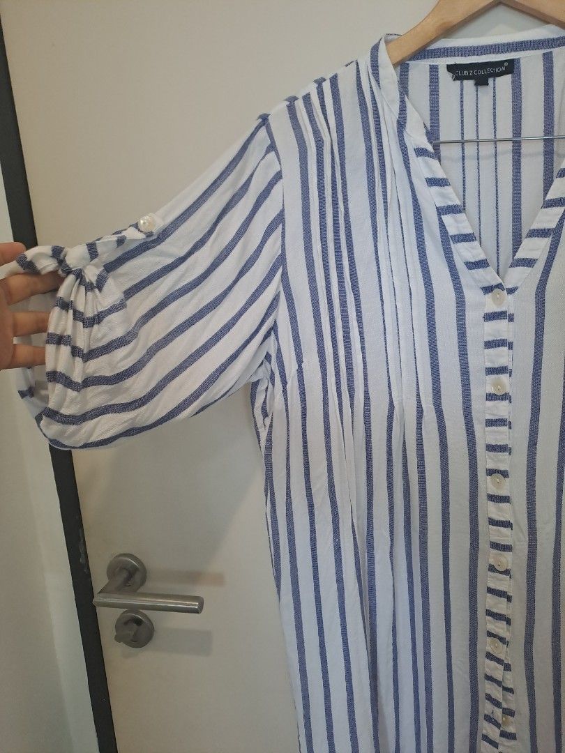Polo longsleve dress (Category: Dresses) located in Manila. Submitted by joanbalde39643 (Listing ID 1462127401, Image 3). Description: This blue and white vertical striped blouse is from the Club Z Collection line. It features a lightweight, textured cotton-blend weave with a relaxed, coastal-inspired silhouette..