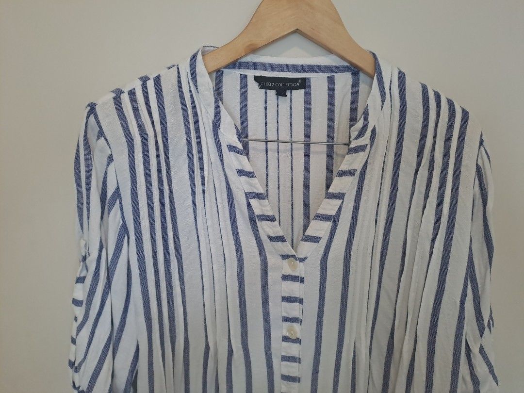 Polo longsleve dress (Category: Dresses) located in Manila. Submitted by joanbalde39643 (Listing ID 1462127401, Image 2). Description: This blue and white vertical striped blouse is from the Club Z Collection line. It features a lightweight, textured cotton-blend weave with a relaxed, coastal-inspired silhouette..