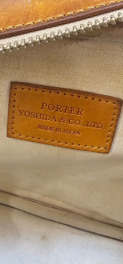 Porter Yoshida & Co. Leather shoulder bag (Category: Sling Bags) located in Navotas City. Submitted by walburst (Listing ID 1462257429, Image 3). Description: Vintage Porter Yoshida & Co. Leather Shoulder Bag Cotton canvas liner Made in Japan Good condition Leather soft and supple (Nice feel to the touch) *patina, scuffs, scratches *strap attachement points repaired *replacement sling strap *minor interior stains.