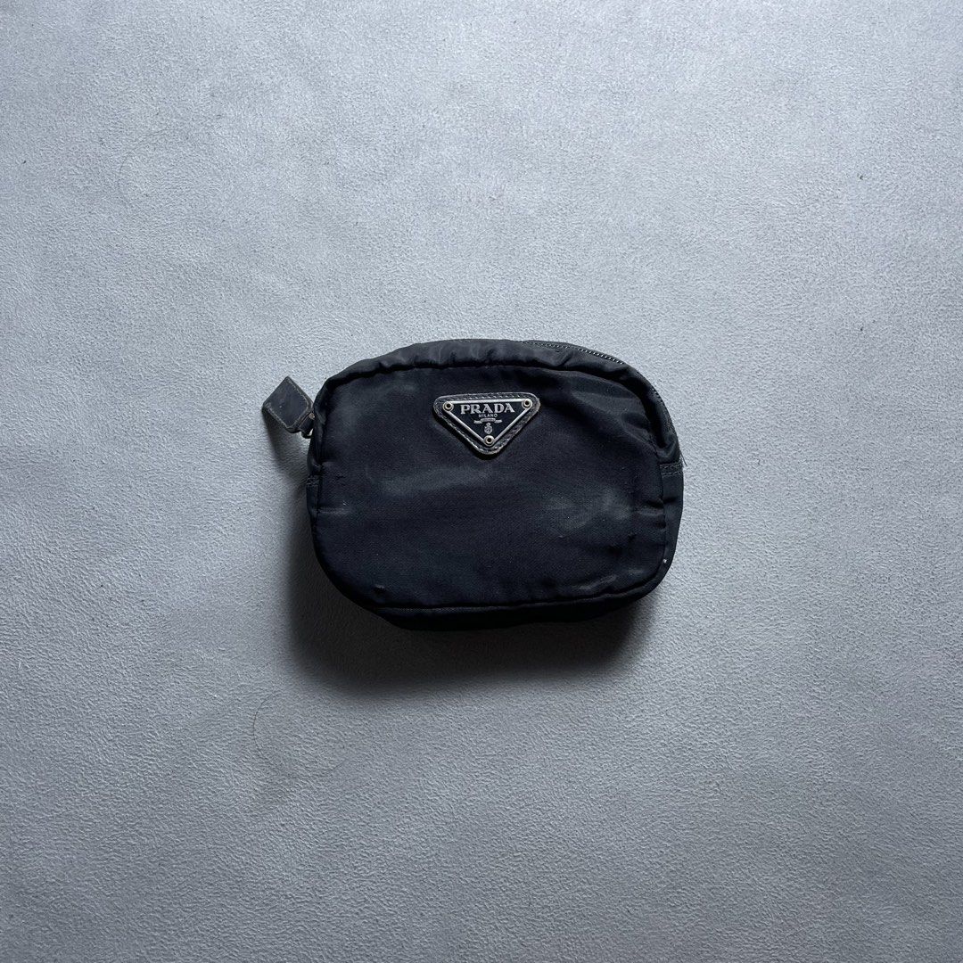 Prada Pouch Wallet (Category: Purses & Pouches) located in Manila. Submitted by revise.ph_ (Listing ID 1462223773, Image 1). Description: Prada Pouch Wallet Made in Italy Height/Length:4 Width:5.8 Side Width:2.3 Issue: scratches check detailed photo Price:2,500 Free Shipping Via Jnt.