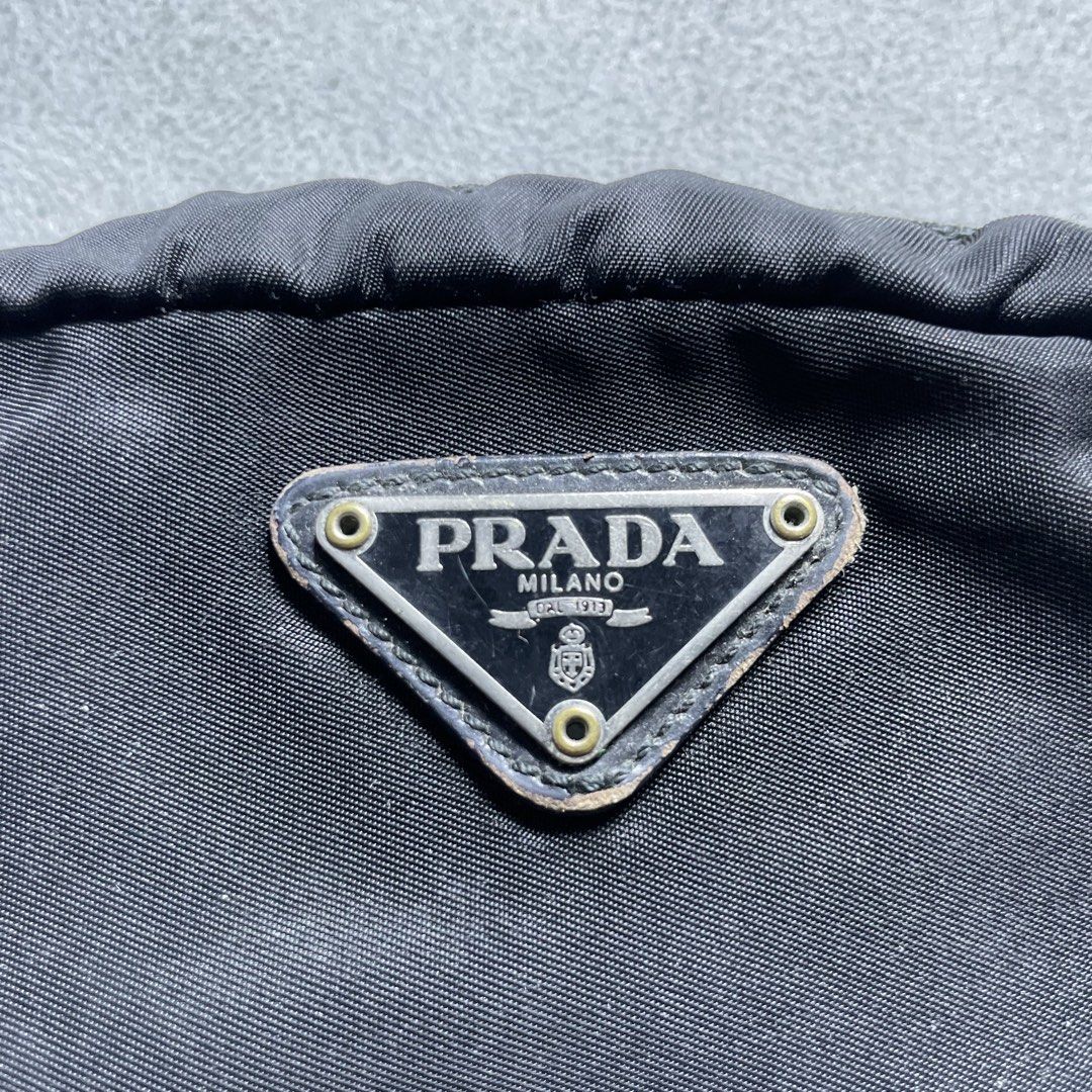 Prada Pouch Wallet (Category: Purses & Pouches) located in Manila. Submitted by revise.ph_ (Listing ID 1462223773, Image 2). Description: Prada Pouch Wallet Made in Italy Height/Length:4 Width:5.8 Side Width:2.3 Issue: scratches check detailed photo Price:2,500 Free Shipping Via Jnt.