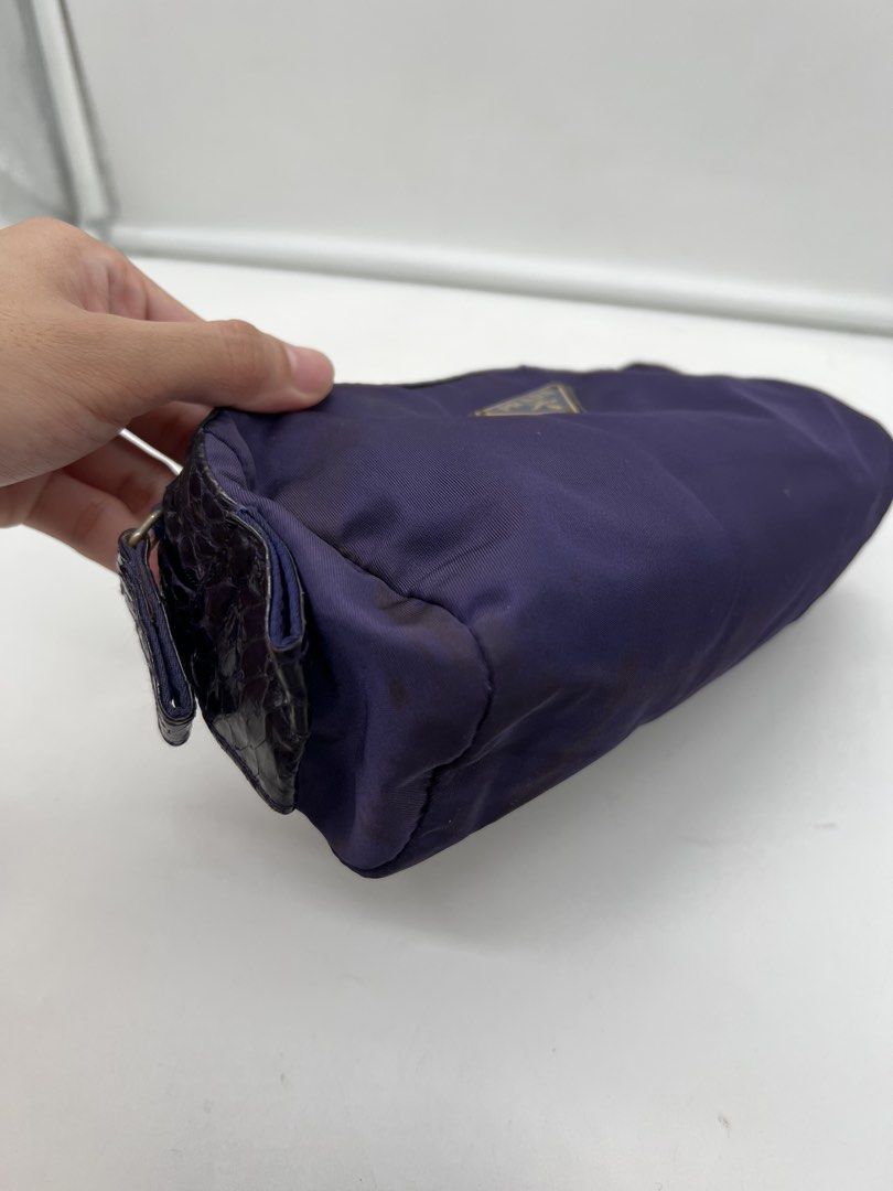 Prada purple nylon cosmetic pouch (Category: Purses & Pouches) located in Cavite. Submitted by aellavier (Listing ID 1462057833, Image 2). Description: preloved, needs washing/ cleaning has signs of use (stains) .