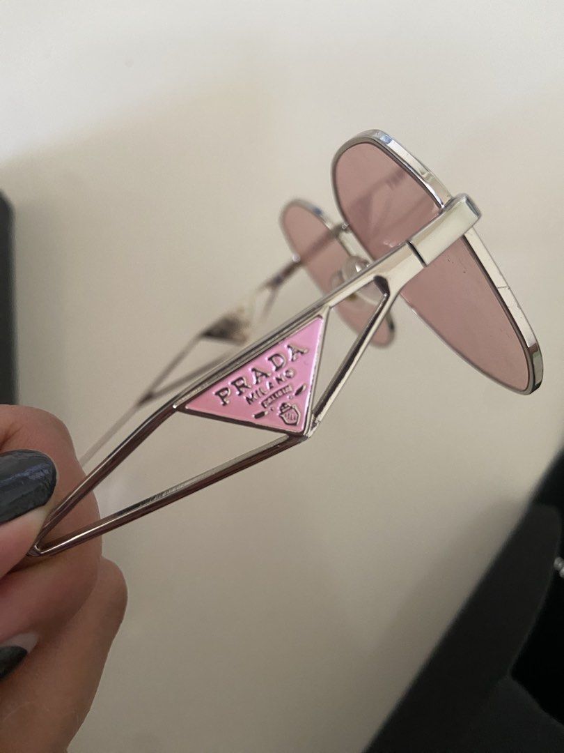 Prada Sunglasses Pink Oval Frame (Category: Sunglasses & Eyewear) located in Bangui. Submitted by loricam (Listing ID 1462054255, Image 3). Description: PRADA Milano Sunglasses ✨ • Like New / Never Used • Rose Gold Frame • Pink/Rose Tinted Lenses • Purchased in USA 🇺🇸 Selling because I wear prescription glasses and don’t get to use them. ❤️ Prada card/certificate was included when purchased but unfortunately got misplaced..